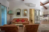 house located in a haven of greenery 15 minutes walk from the beach of Maora