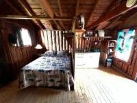 Classic original cedar log cabins set on Simms Stream in the North East Kingdom.