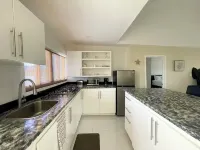 Newly Built 2-Bedroom Villa Short Walk From Beach & Minutes away from Airport! Hotels in Moss Town
