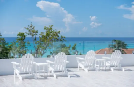 Private 7 Mile Beach Beach Club. Ocean views from Roof Terrace and Pool Pavilion