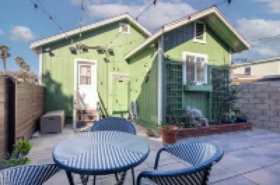 Across quiet street from sandy beach.