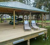 Heron's Cove Lake House with dock and kayaks