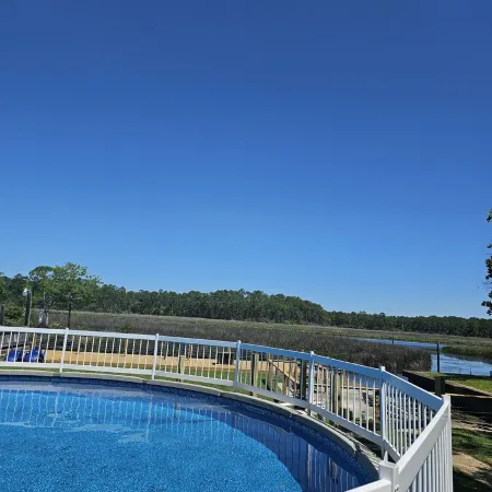 HotTub/Fish/RIVER FRONT/DOGS/SUMMER POOL.RIGHT BY GULF AND BEACHES. BRING BOAT!