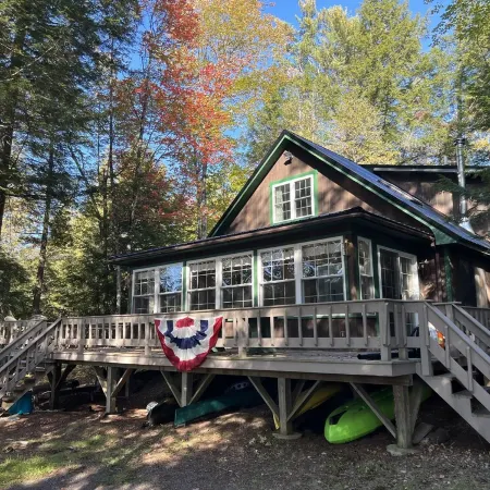 Cozy  Sebec Lake front cabin with dock and fire pit
