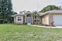 Come Home to Paradise….Screened in pool with covered lanai and hot tub