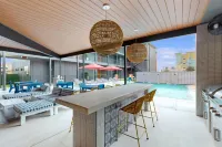 Private Balcony and Stunning Pool Amenities - Elegant Sanctuary
