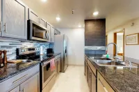 Lakefront Condo with Mountain Views & Shared Hot Tub - Walk to Town & Ski Access