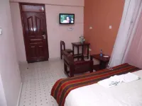 Alpine Hotel Hotels near Wa Mumbi Wimbi Store