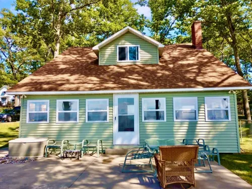 New Listing! Lake front cottage with 100' of private sandy beach