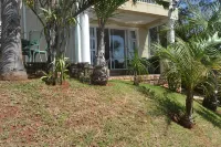 Cozy one bedroom suite, with a balcony, overlooking the pool and braai area.