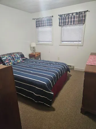 Charming 3-bedroom cabin in Casco with Sebago Lake access and a dock.