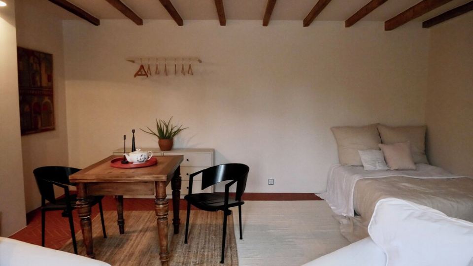 Comfortable living on a farm surrounded by greenery and art