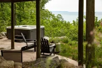 Secluded Log Cabin Retreat on 11 Wooded Acres with Hot Tub & Lake Michigan Views