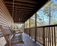 Beautiful cabin with fireplace and wrap around porch and private upstair balcony