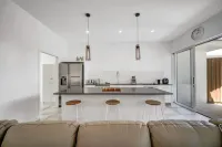 Tropical Private Oasis with heated pool just a short walk away from 4 mile beach