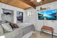 Cozy 3BR lakefront cottage with hot tub perfect for families w/ private dock.