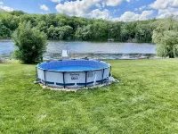 Your Dream Getaway 220’ Waterfront Beach House Rock River WI FP Pool Pier Kayaks