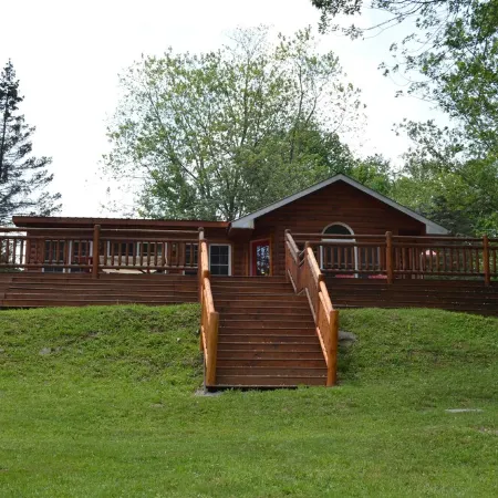 Spectacular Catskill Mountain River Front Custom Log Home