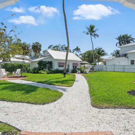 The Historic Coquina Cottages C is 2 Blocks to the Beach, 5th Avenue and 3rd St.