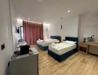 Suites Kozi Hotel a 
