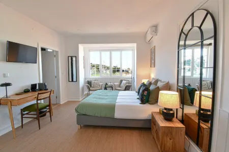 ArchiSuites Отели рядом с достопримечательностью «Baroque Library - University of Coimbra»