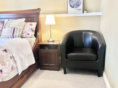 Legal Walkout suite with King-bed, Kitchen, Parking & Patio Hotels near Canadian Tire