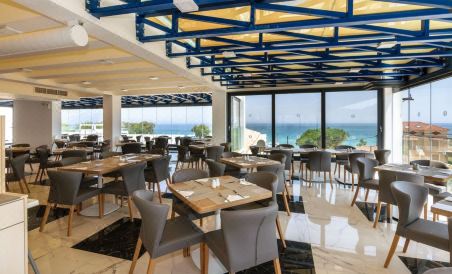Cavo Orient Beach Hotel & Suites - Housity