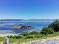 The apartment is located in front of Langosteira beach, with stunning views.