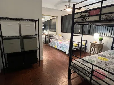 Sleeps 30 Large Heated Pool Home, 10 min to Hard Rock and 22 minutes to Beach Hotels near Publix Super Market at Flamingo Pines Plaza