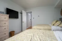Contemporary, clean 1-bedroom mid-town condo with bay view and 1 block to beach.