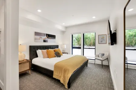 Pets Stay Free • Private Terrace • Elevator • King Beds • In-Unit W/D