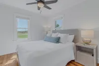 Waterfront retreat with dock, kayaks, and outdoor living. Bring the boat!