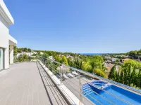 Large modern villa with indoor and outdoor pool sauna and bar.