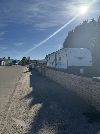 RV in foothills located near stores. Smoking area with fire pit provided.