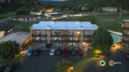 Slope-Side Balcony and Stone Fireplace - Cozy Rustic Retreat