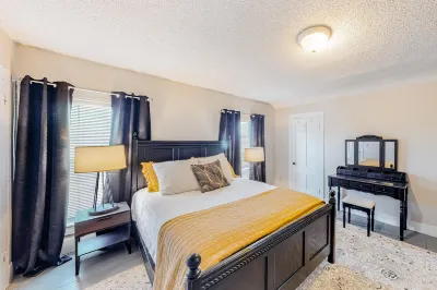 Spacious two-story duplex with a large yard, two full kitchens, & gas fireplace