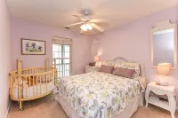 Spacious Outdoor Showers and Wrap-Around Porch - Inviting Family Haven