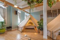 Experience Stay at the Glamping Loft Lake Geneva |Group Stays |12 Stylish Tent Suites |Kitchen & Bar Hotels in Lake Geneva