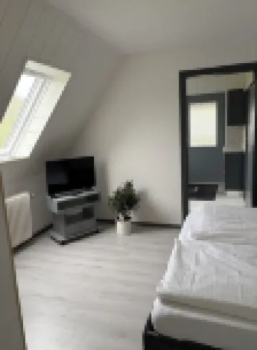 Kleine Ferienwohnung , Direkt am Deich und Hafen von Eckwarden mit Gartennutzung