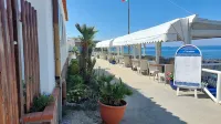 THE MERIDIANA APARTMENT ON THE SEA WITH PRIVATE BEACH SDRAIO AND UMBRELLA
