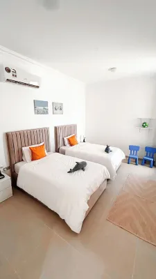 Spacious 3-bedroom apartment in charming As Sifah with WiFi, AC Hotels near Jebel Sifah Marina