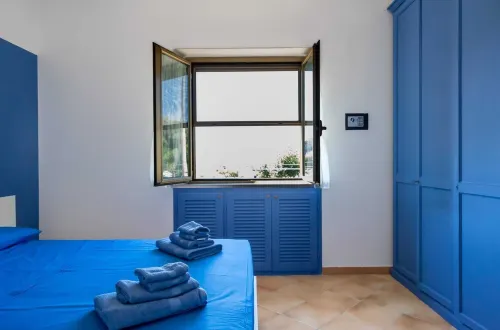 Apartment in portion of villa with solarium and beach.