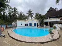 Luxurious 4-Bedroom Holiday House with Pool Access in Diani Beach - 2-Star