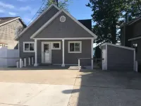 Experience Lake Life at Our 3-Bedroom Beachfront Cottage, Near Grand Rapids.