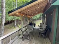 Cozy  Sebec Lake front cabin with dock and fire pit