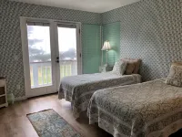 Beachfront home directly across from beach & park! Close to everything!