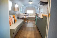 Glamping in Vintage Airstream with modern comforts with private pond access.
