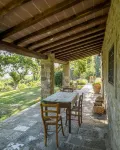 Tuscan stone villa with private pool surrounded by greenery
