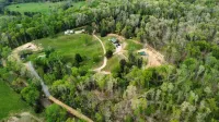 Peaceful Hills Retreat’s cottage is clean and cozy with a creek on 97 acres
