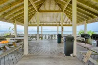 Water view studio with a patio, pool access, and central AC - snowbird friendly